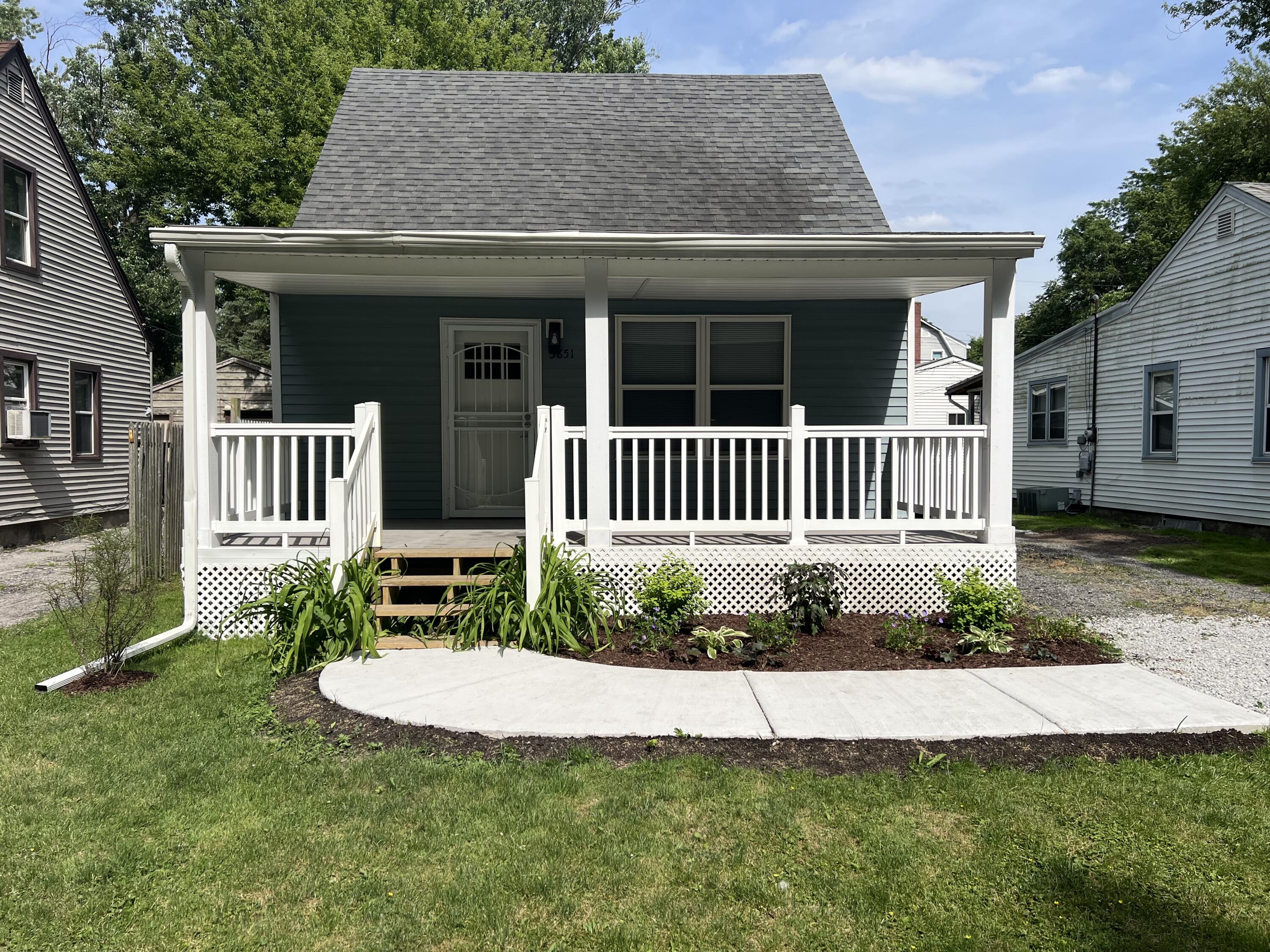 3851 Maple Street Hobart, IN 46342 - Photo 1 of 28 a view of a house with a yard and a garden