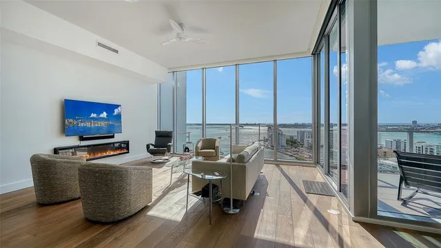 a view of a livingroom with workspace and a couch