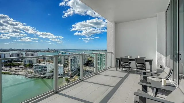 a view of a swimming pool with a lounge chairs