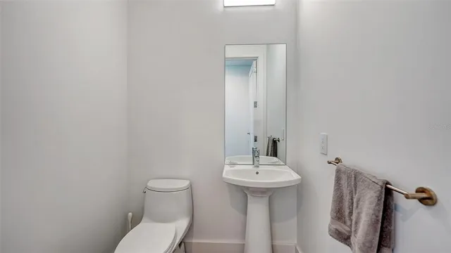 a view of a swimming pool with a garden and patio