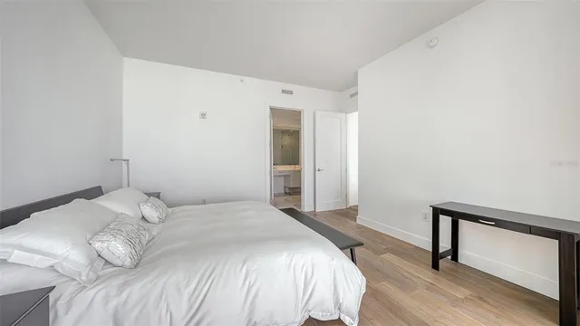 a living room with fireplace furniture and a large window