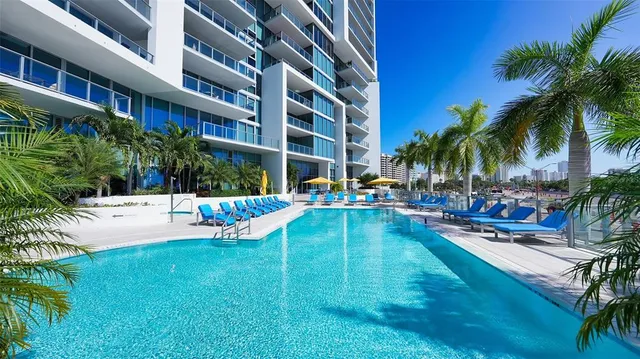 a city view and swimming pool outdoor seating