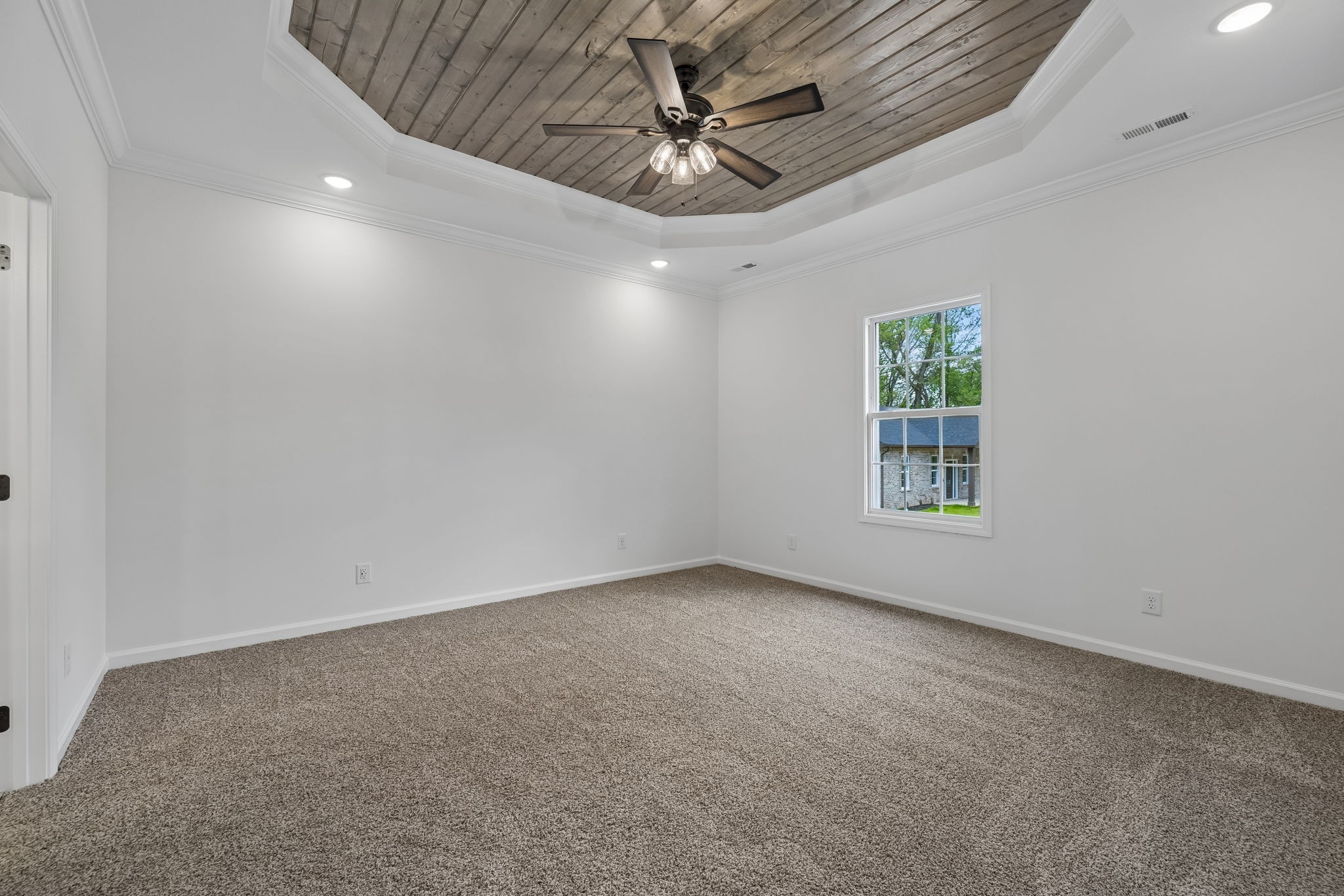 613 Hill Road Clarksville, TN 37040 - Photo 15 of 30 an empty room with a chandelier fan and windows