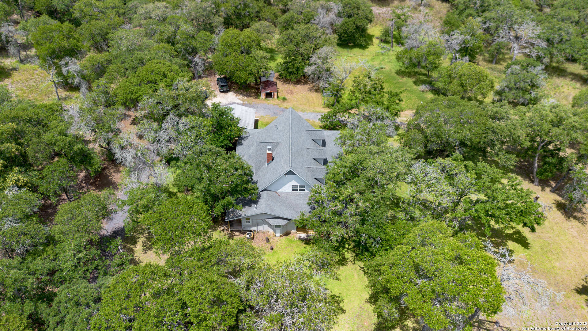 2981 Vivroux Ranch Road Seguin, TX 78155 - Photo 50 of 50 an aerial view of residential house with outdoor space and trees all around