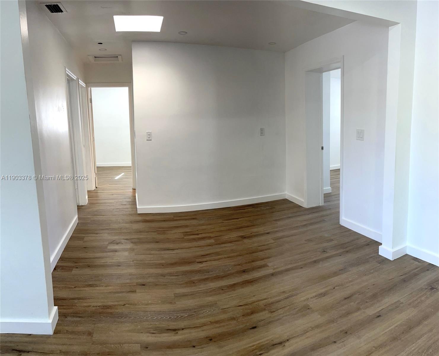 4640 Southwest 94th Court Miami, FL 33165 - Photo 7 of 37 a view of a hallway with wooden floor