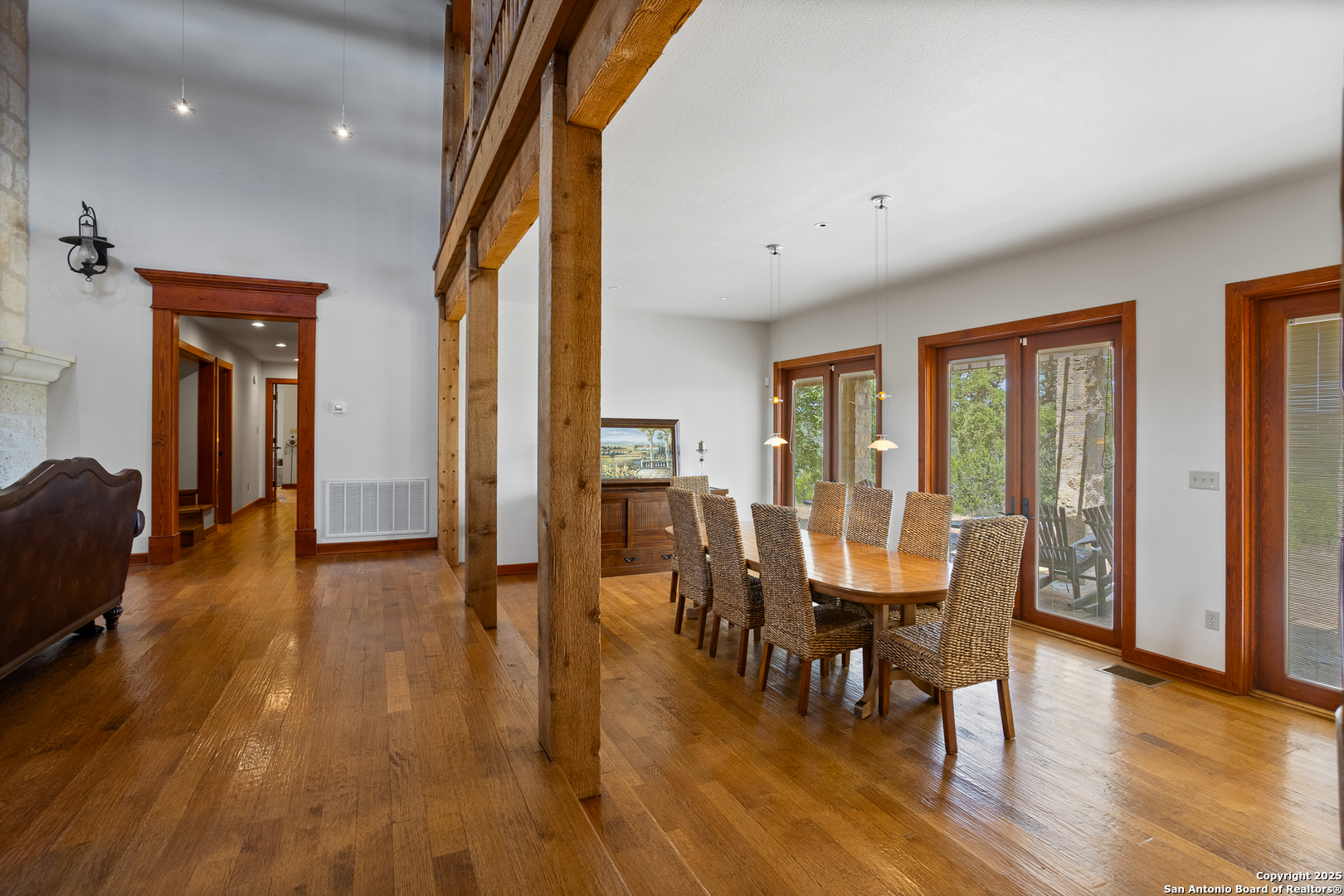 597 Krause Road Pipe Creek, TX 78063 - Photo 11 of 70 a view of a dining room with furniture window and wooden floor