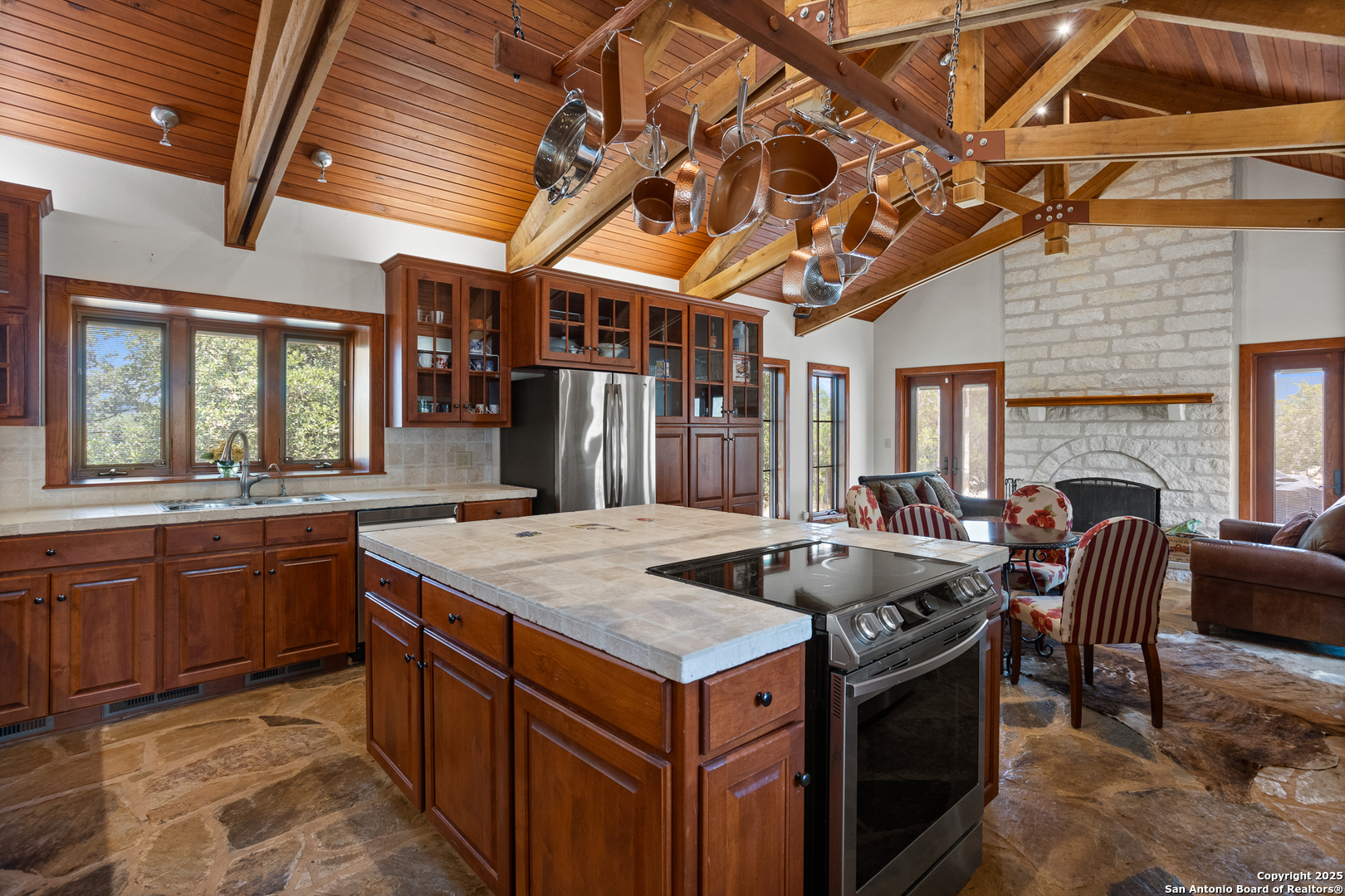 597 Krause Road Pipe Creek, TX 78063 - Photo 14 of 70 a kitchen with a stove and a refrigerator