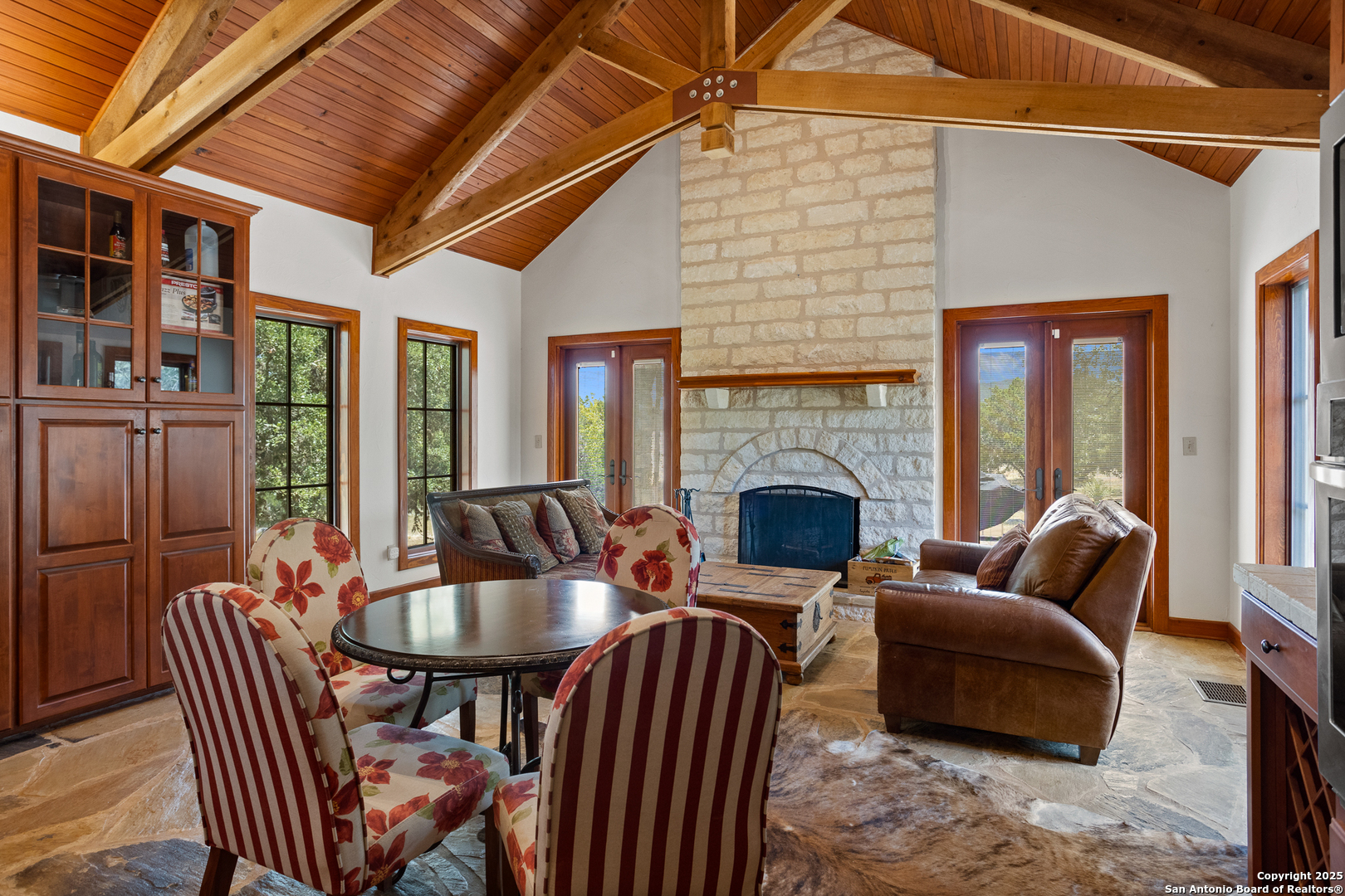 597 Krause Road Pipe Creek, TX 78063 - Photo 15 of 70 a outdoor living space with furniture and a fireplace