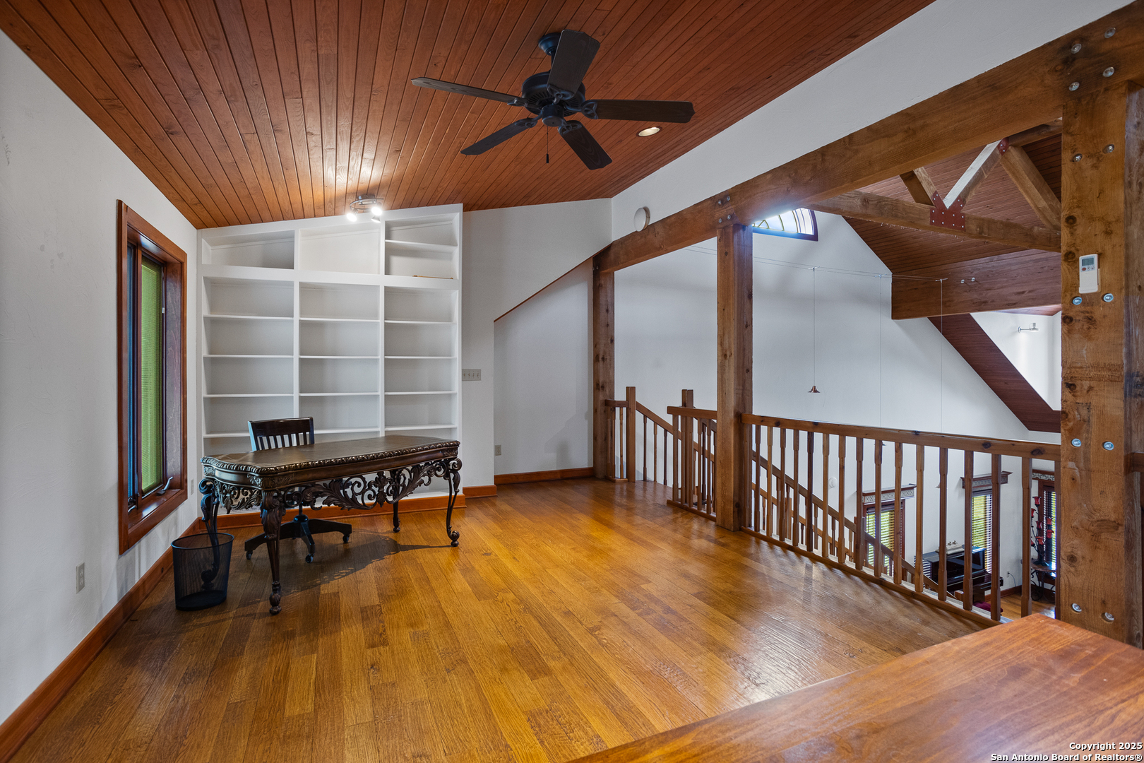 597 Krause Road Pipe Creek, TX 78063 - Photo 24 of 70 a view of a livingroom with furniture and hardwood floor
