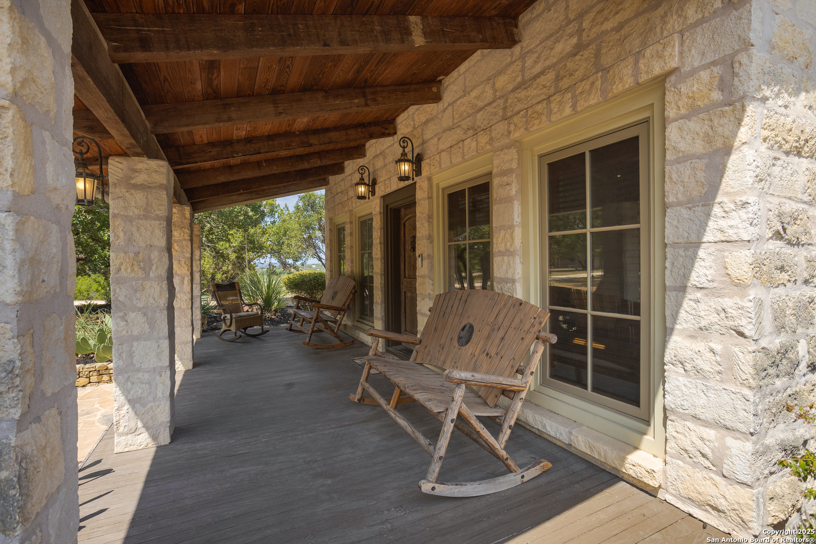 597 Krause Road Pipe Creek, TX 78063 - Photo 4 of 70 a view of a porch with chairs and backyard