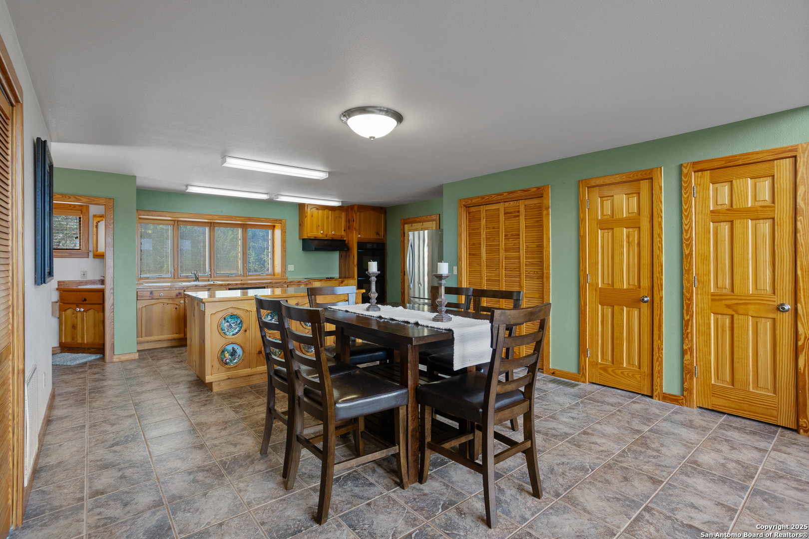 597 Krause Road Pipe Creek, TX 78063 - Photo 59 of 70 a view of a dining room with furniture window and outside view