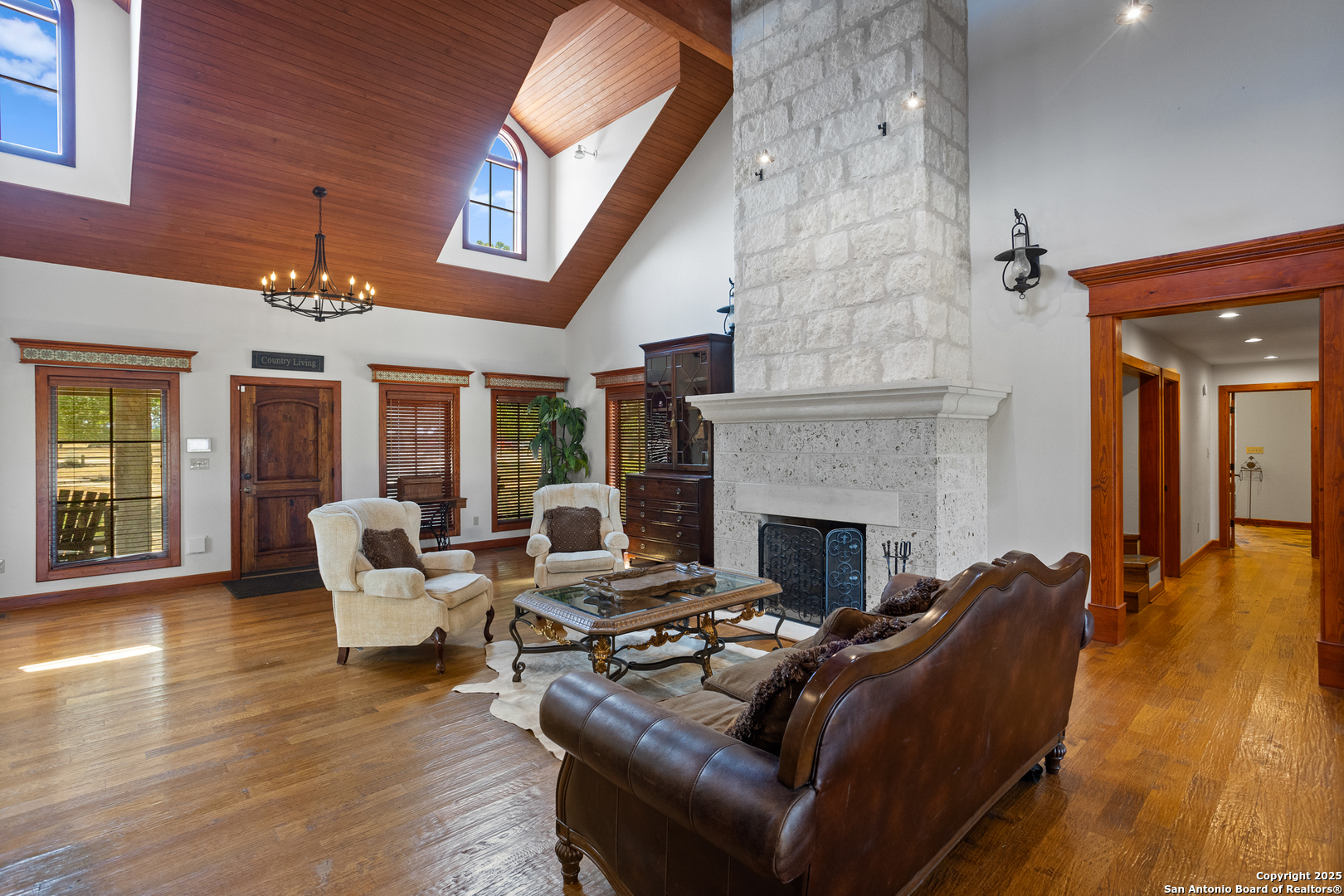 597 Krause Road Pipe Creek, TX 78063 - Photo 6 of 70 a living room with furniture and a fireplace