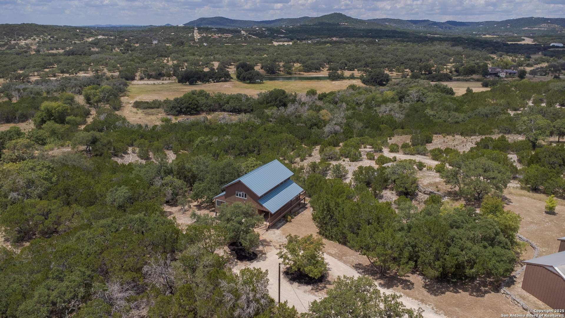 597 Krause Road Pipe Creek, TX 78063 - Photo 66 of 70 an aerial view of a house with a yard