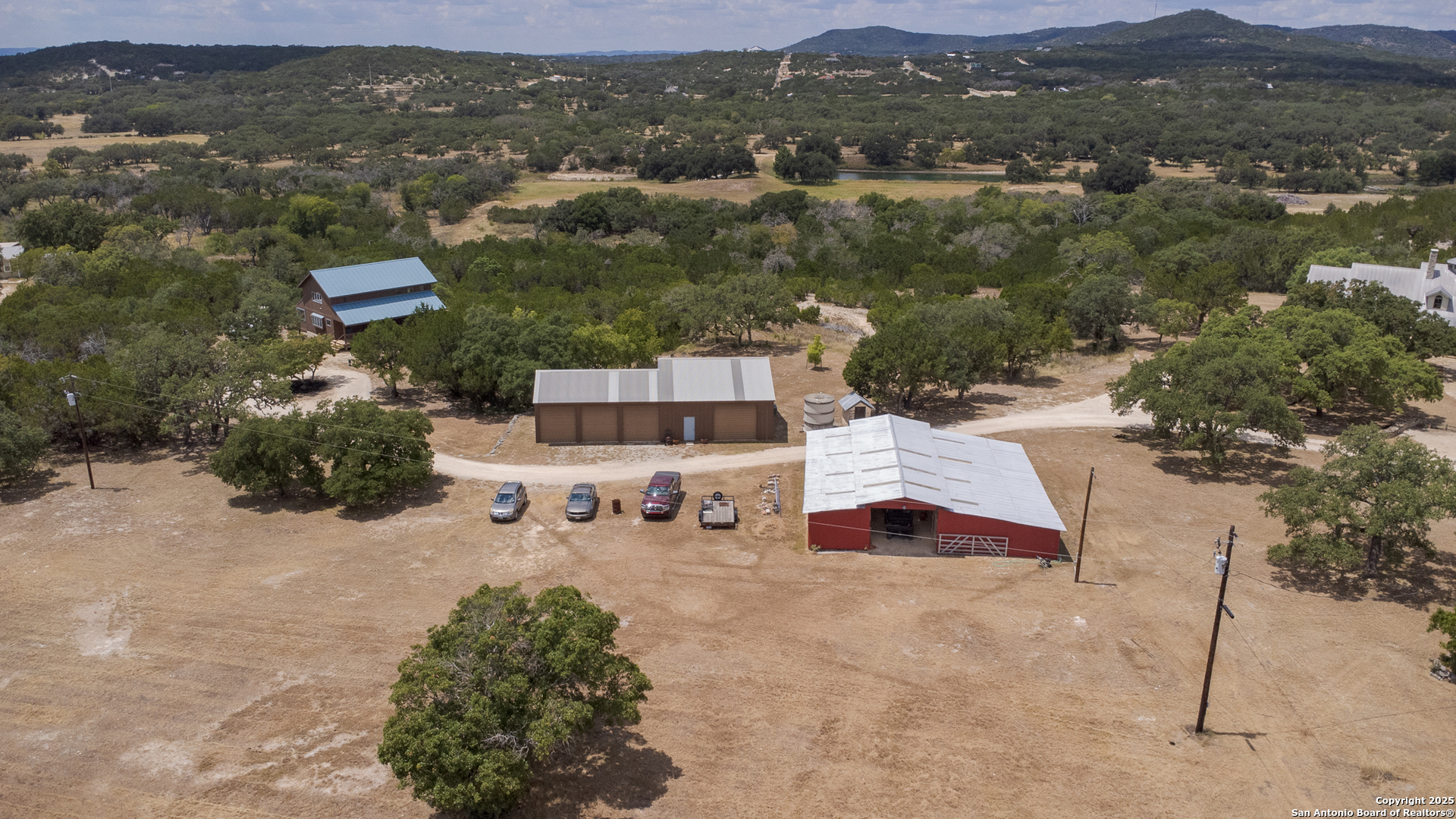 597 Krause Road Pipe Creek, TX 78063 - Photo 67 of 70 an aerial view of a house with a yard