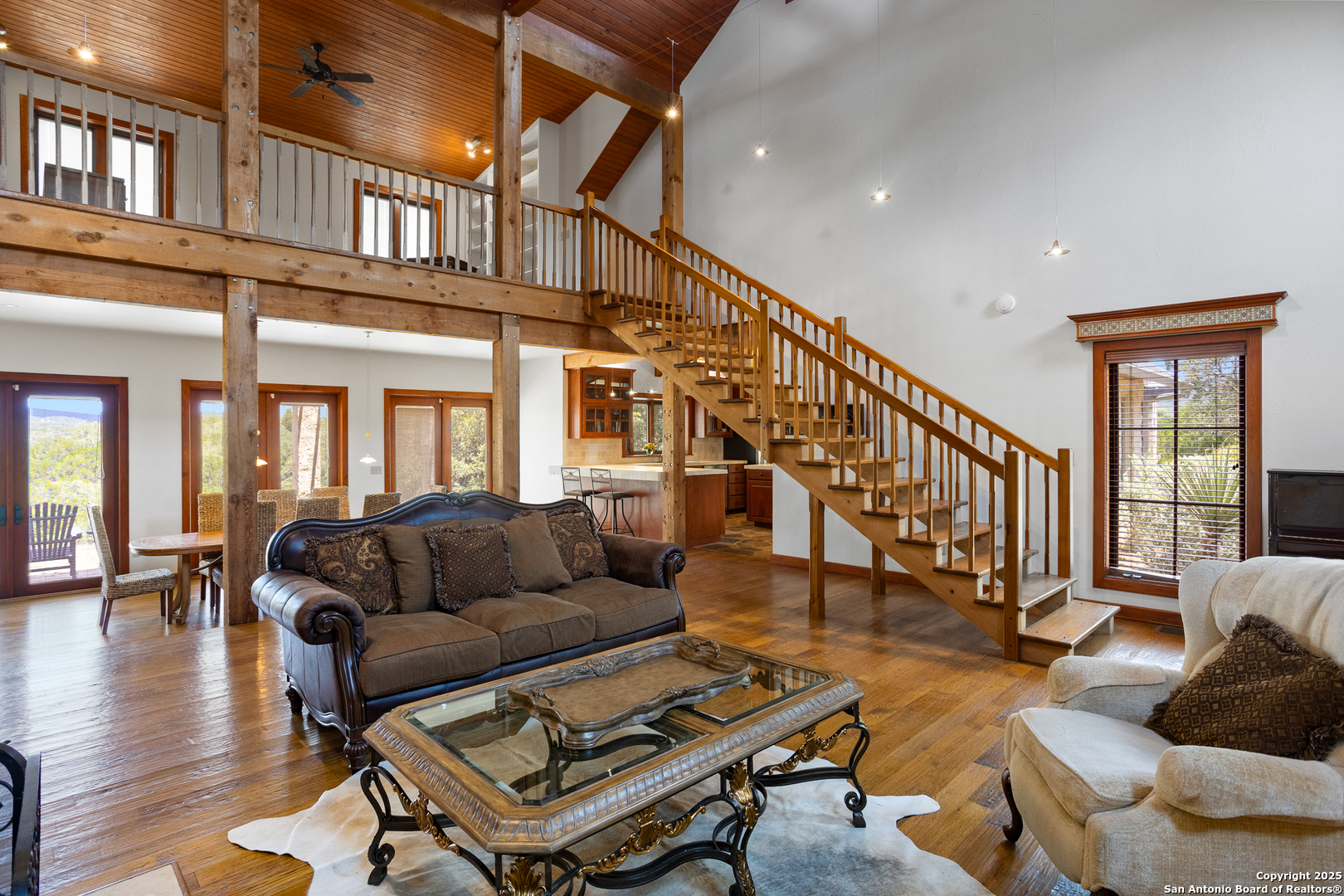 597 Krause Road Pipe Creek, TX 78063 - Photo 10 of 70 a living room with furniture or stairs and a wooden floor