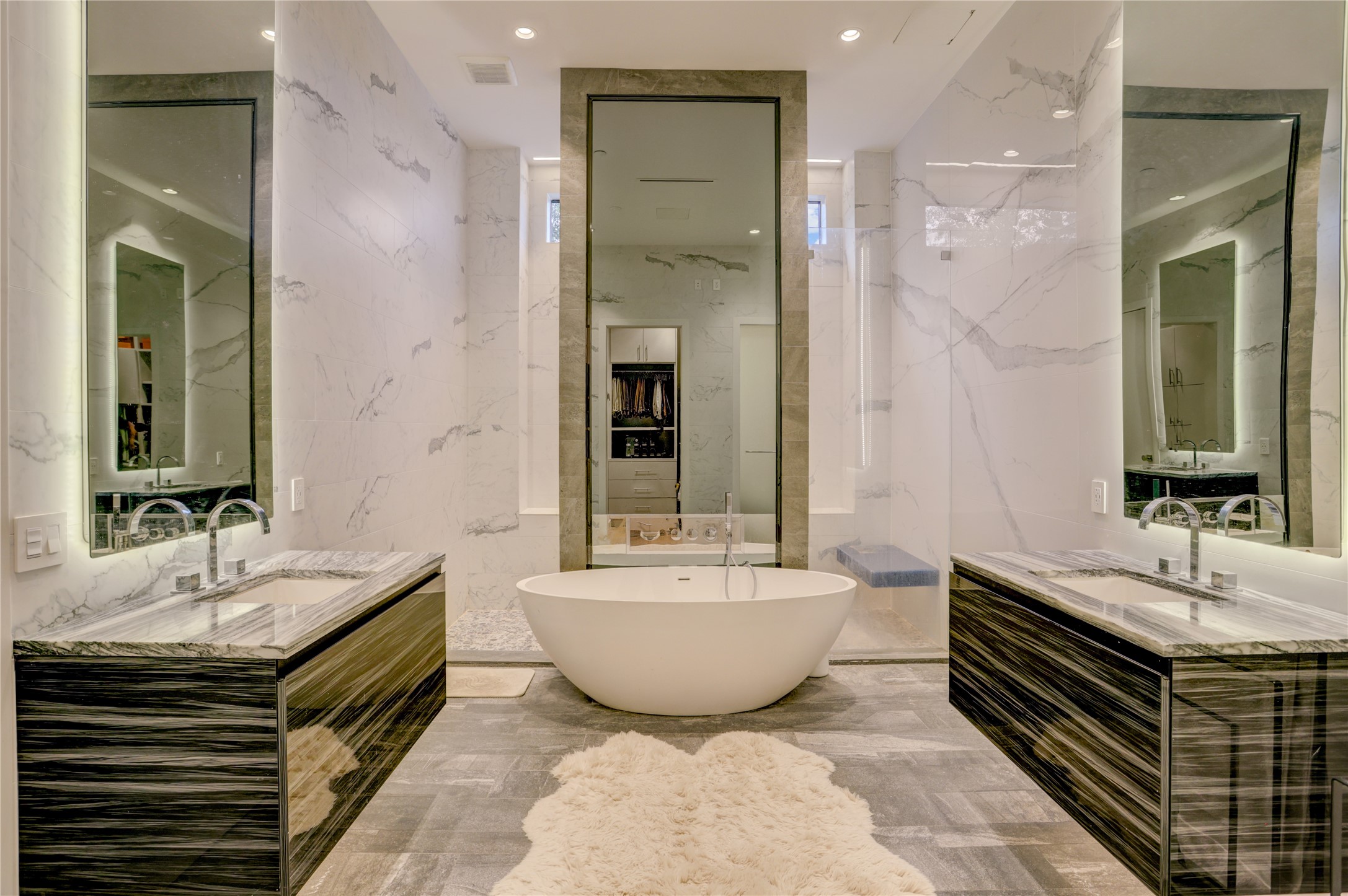 1807 Indiana Street Houston, TX 77006 - Photo 25 of 35 Primary Bath Alternate: Symmetry-driven view of the primary retreat highlighting his-and-her vanities flanking a central freestanding soaking tub, backed by a massive, dual-entry walk-in rain shower space.