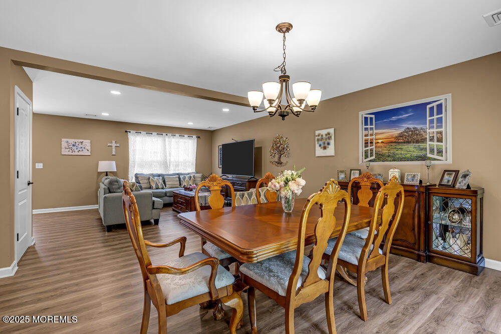 119 Darien Road Howell, NJ 07731 - Photo 13 of 47 a view of a dining room with furniture window and wooden floor