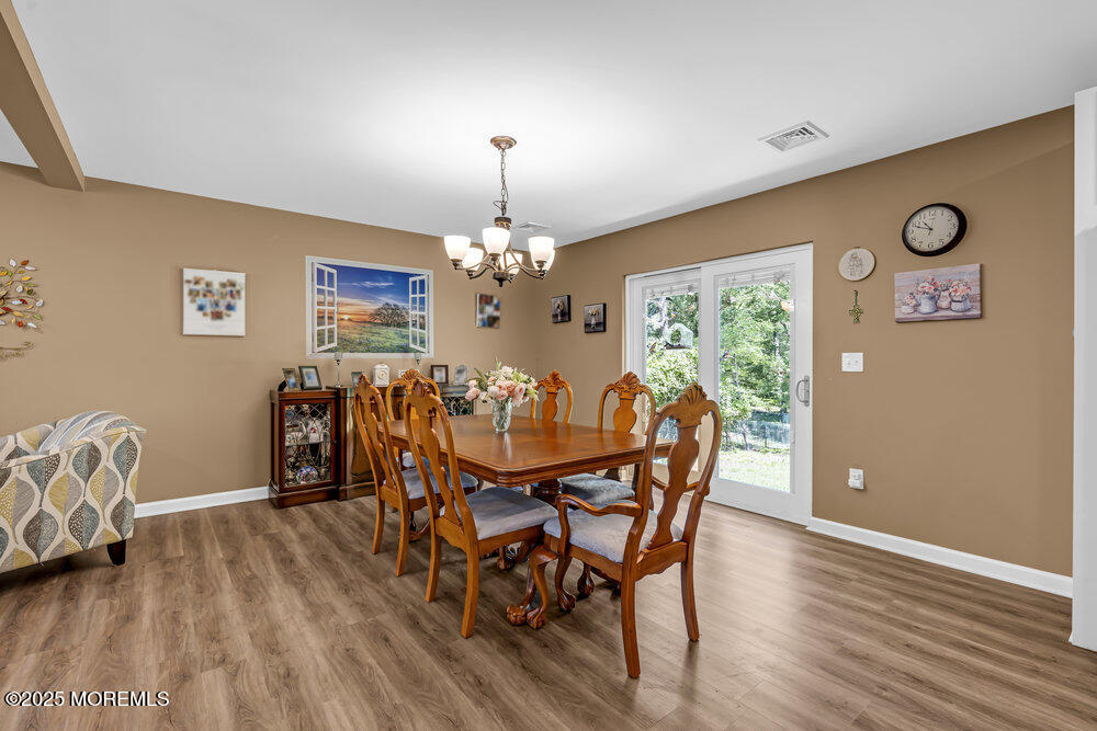 119 Darien Road Howell, NJ 07731 - Photo 14 of 47 a view of a dining room with furniture and chandelier