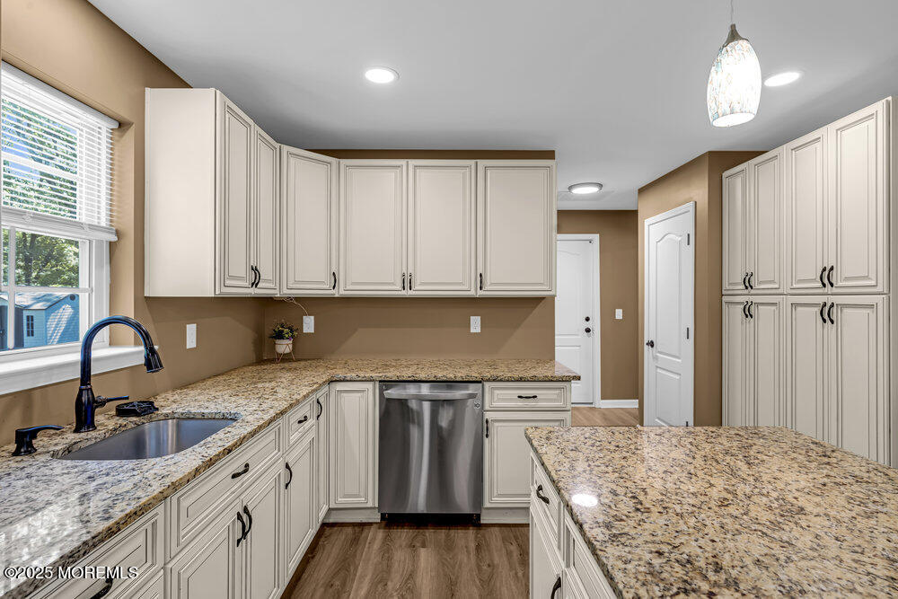 119 Darien Road Howell, NJ 07731 - Photo 17 of 47 a kitchen with stainless steel appliances granite countertop a sink stove and refrigerator