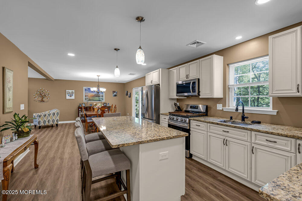119 Darien Road Howell, NJ 07731 - Photo 19 of 47 a kitchen with sink a microwave and cabinets
