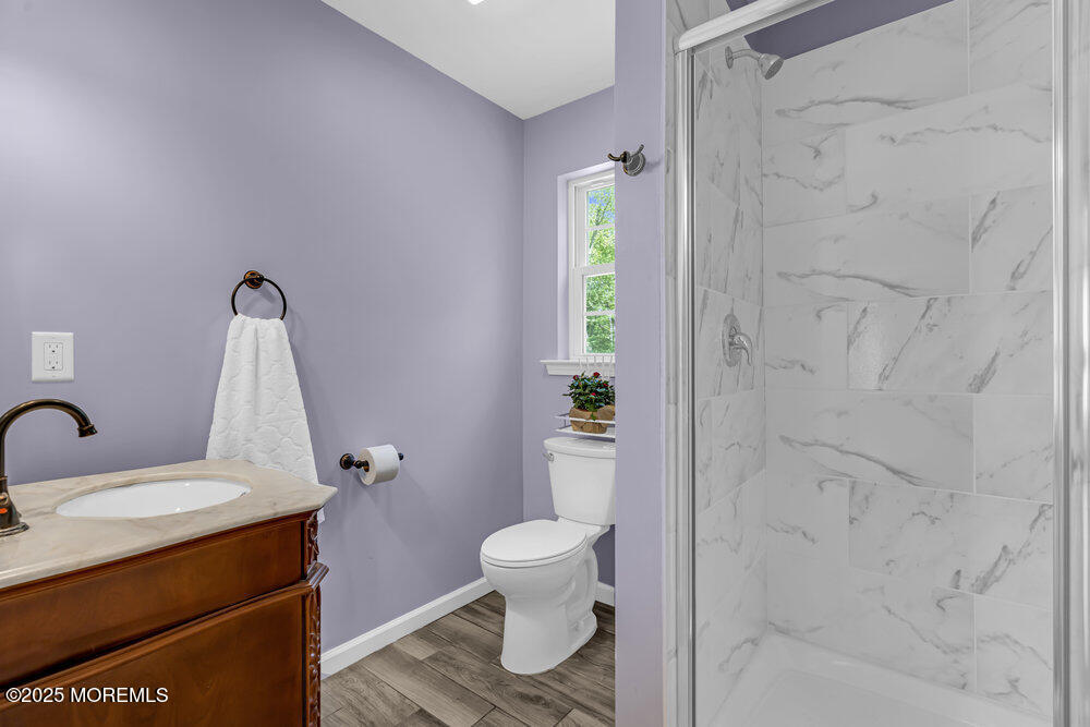 119 Darien Road Howell, NJ 07731 - Photo 22 of 47 a bathroom with a sink toilet and shower