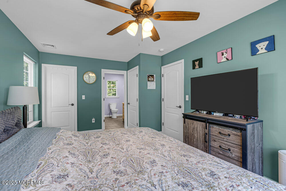 119 Darien Road Howell, NJ 07731 - Photo 25 of 47 a bedroom with a bed and a flat screen tv