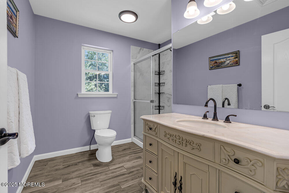 119 Darien Road Howell, NJ 07731 - Photo 26 of 47 a bathroom with a sink a toilet and a mirror