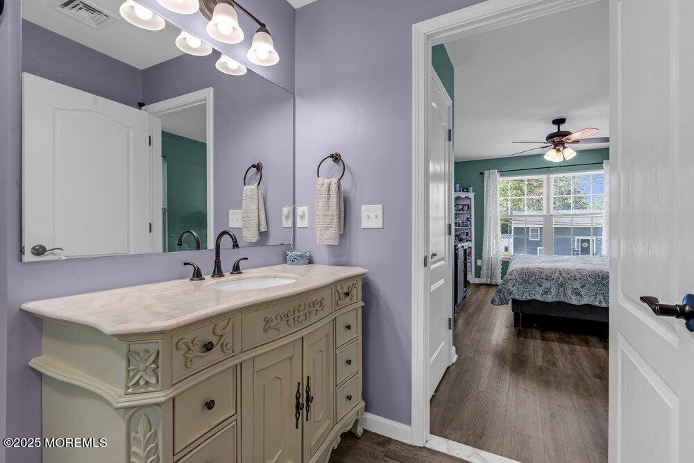 119 Darien Road Howell, NJ 07731 - Photo 27 of 47 a bathroom with a sink and a mirror