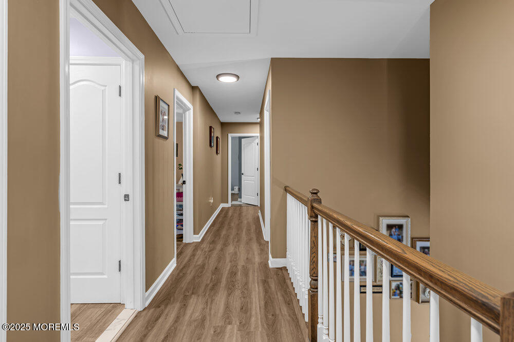 119 Darien Road Howell, NJ 07731 - Photo 30 of 47 a view of a hallway with wooden floor and staircase