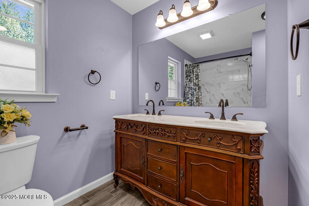 119 Darien Road Howell, NJ 07731 - Photo 32 of 47 a bathroom with a sink mirror vanity and toilet