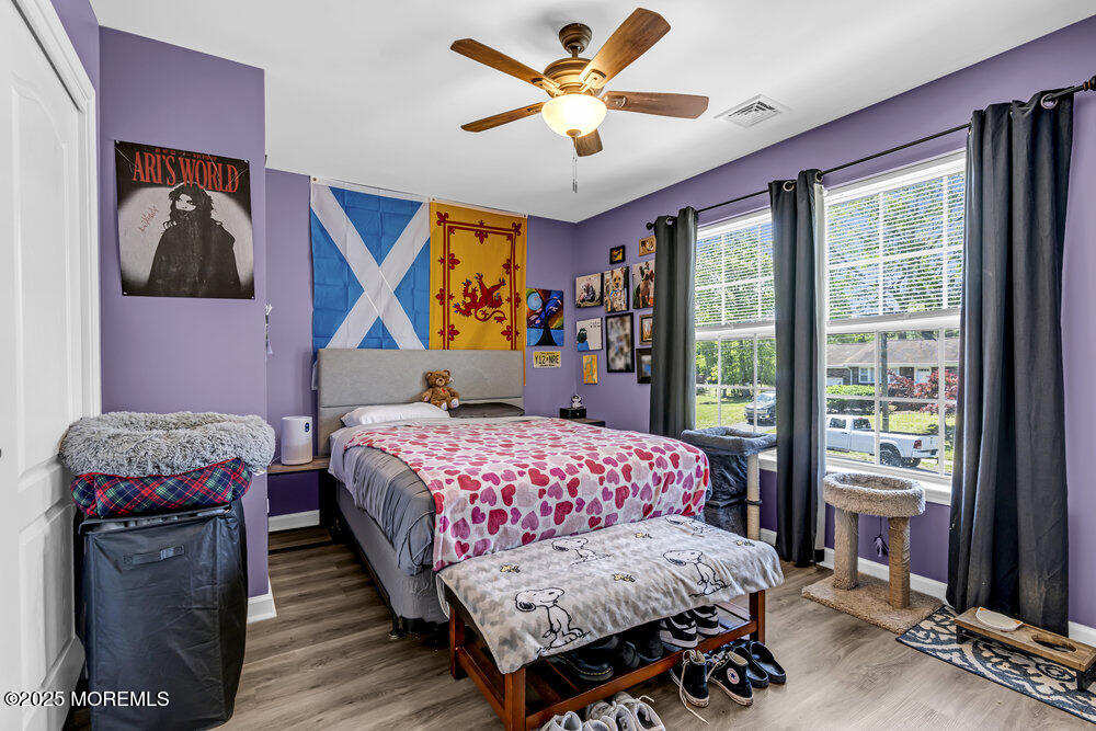 119 Darien Road Howell, NJ 07731 - Photo 34 of 47 a bedroom with a bed and a large window with a mirror on dresser