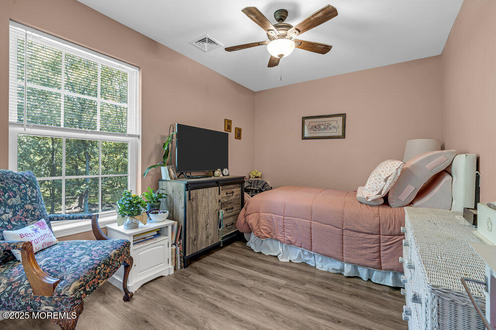 119 Darien Road Howell, NJ 07731 - Photo 35 of 47 a bedroom with a bed and a flat screen tv