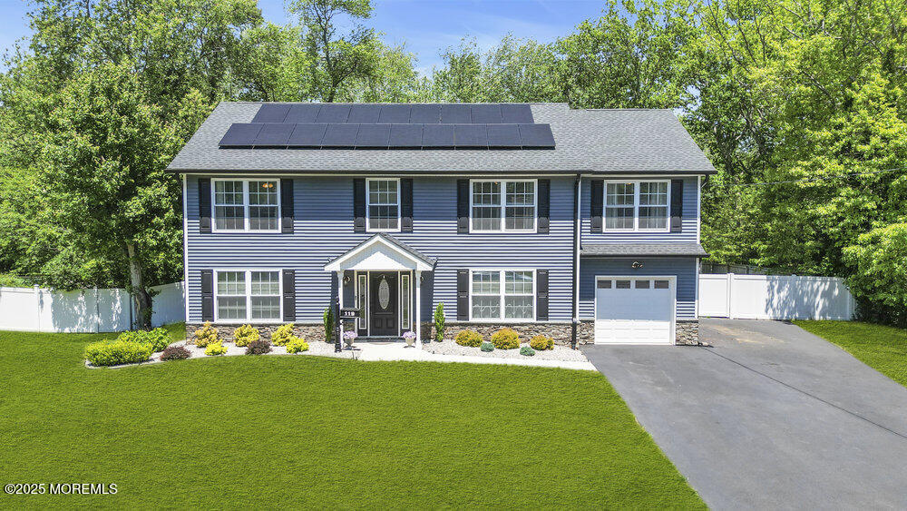 119 Darien Road Howell, NJ 07731 - Photo 39 of 47 a aerial view of a house with a yard table and chairs