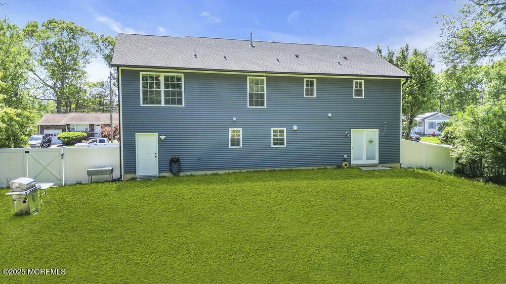 119 Darien Road Howell, NJ 07731 - Photo 40 of 47 a front view of a house with a garden