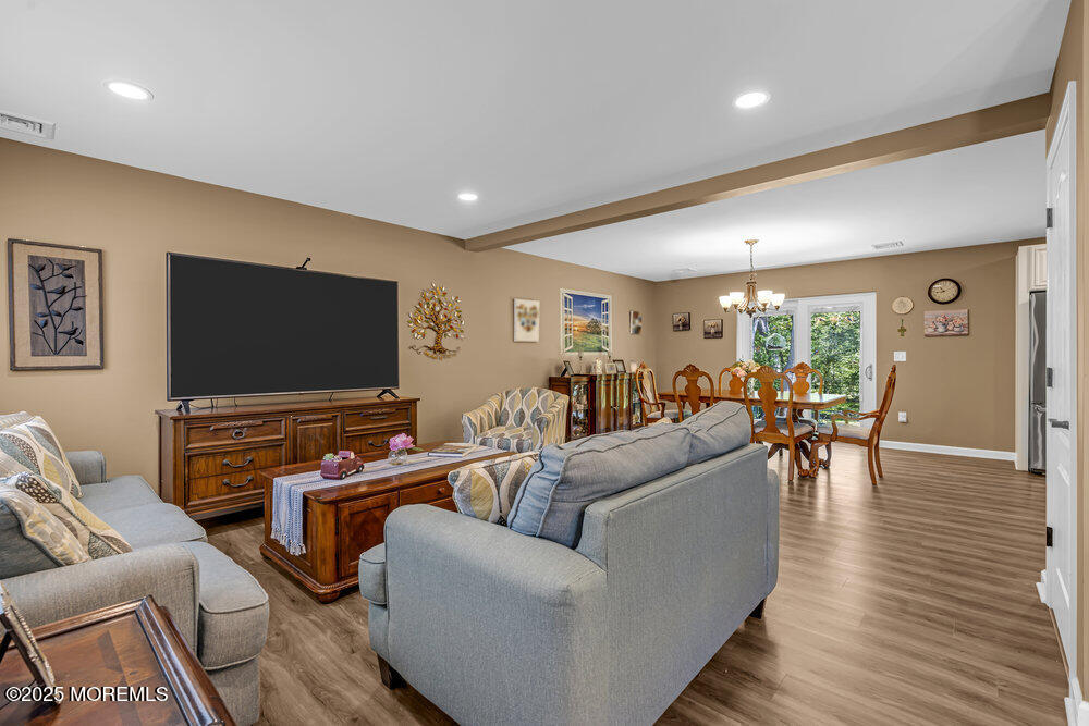 119 Darien Road Howell, NJ 07731 - Photo 6 of 47 a living room with furniture and a flat screen tv