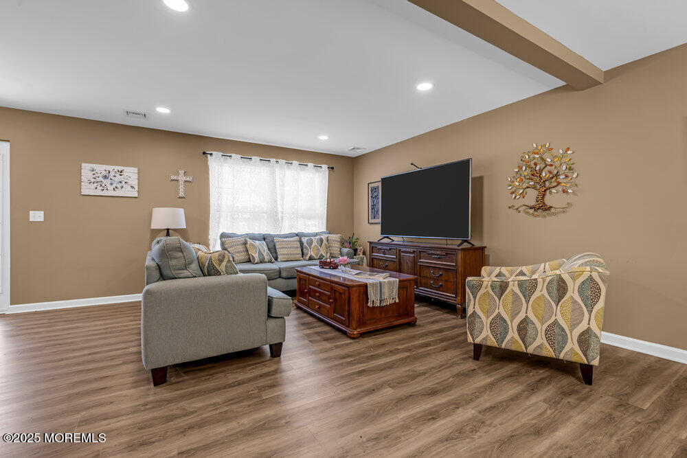 119 Darien Road Howell, NJ 07731 - Photo 7 of 47 a living room with furniture and a flat screen tv
