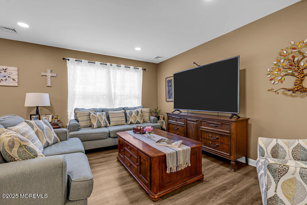 119 Darien Road Howell, NJ 07731 - Photo 8 of 47 a living room with furniture and a flat screen tv