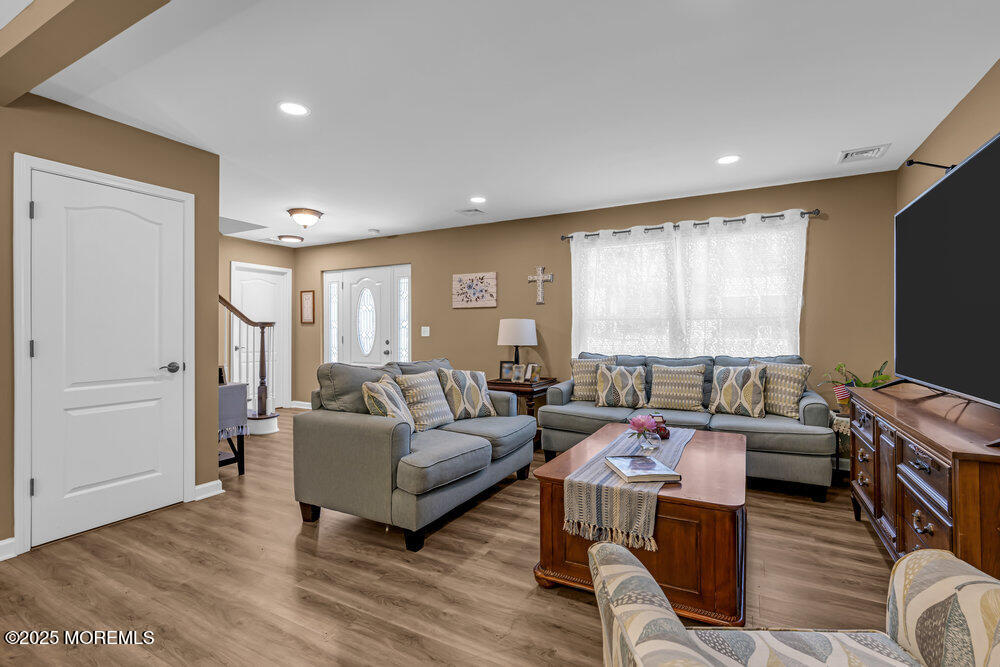 119 Darien Road Howell, NJ 07731 - Photo 9 of 47 a living room with furniture flat screen tv and a large window