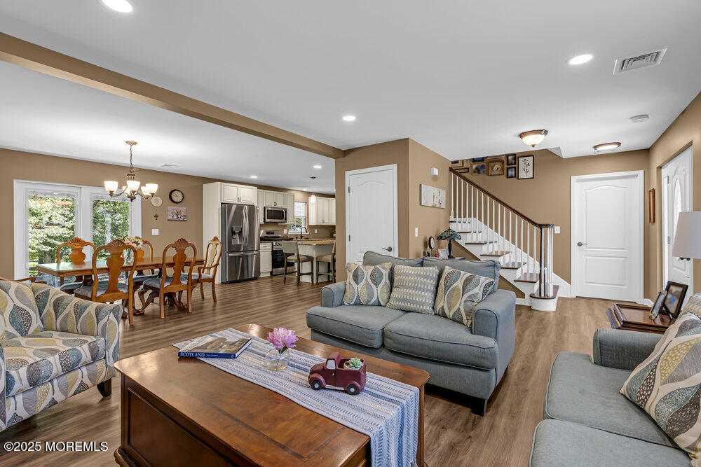 119 Darien Road Howell, NJ 07731 - Photo 10 of 47 a living room with furniture and wooden floor