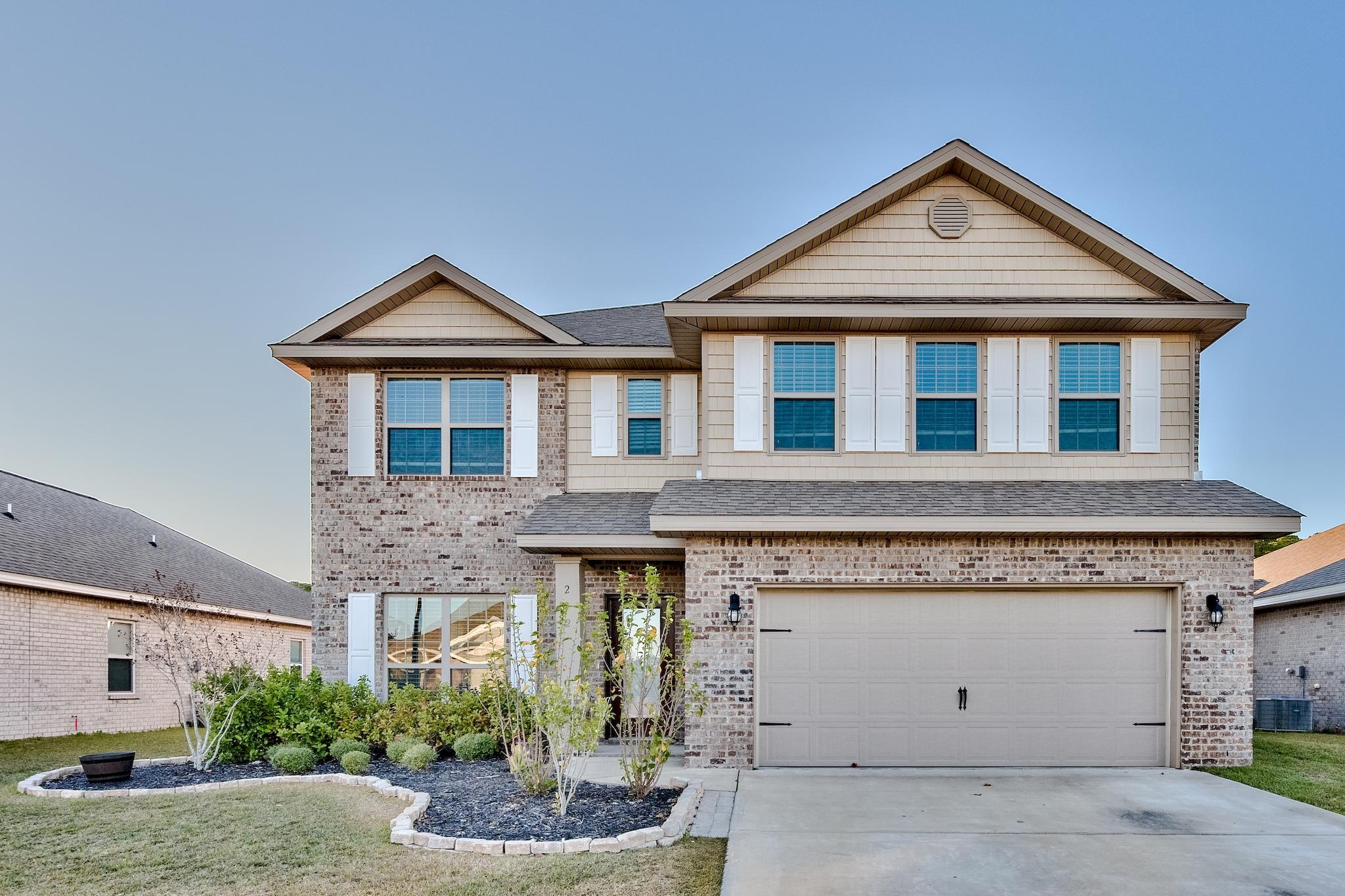 242 Pin Oak Loop Santa Rosa Beach, FL 32459 - Photo 1 of 43 a front view of a house with a yard