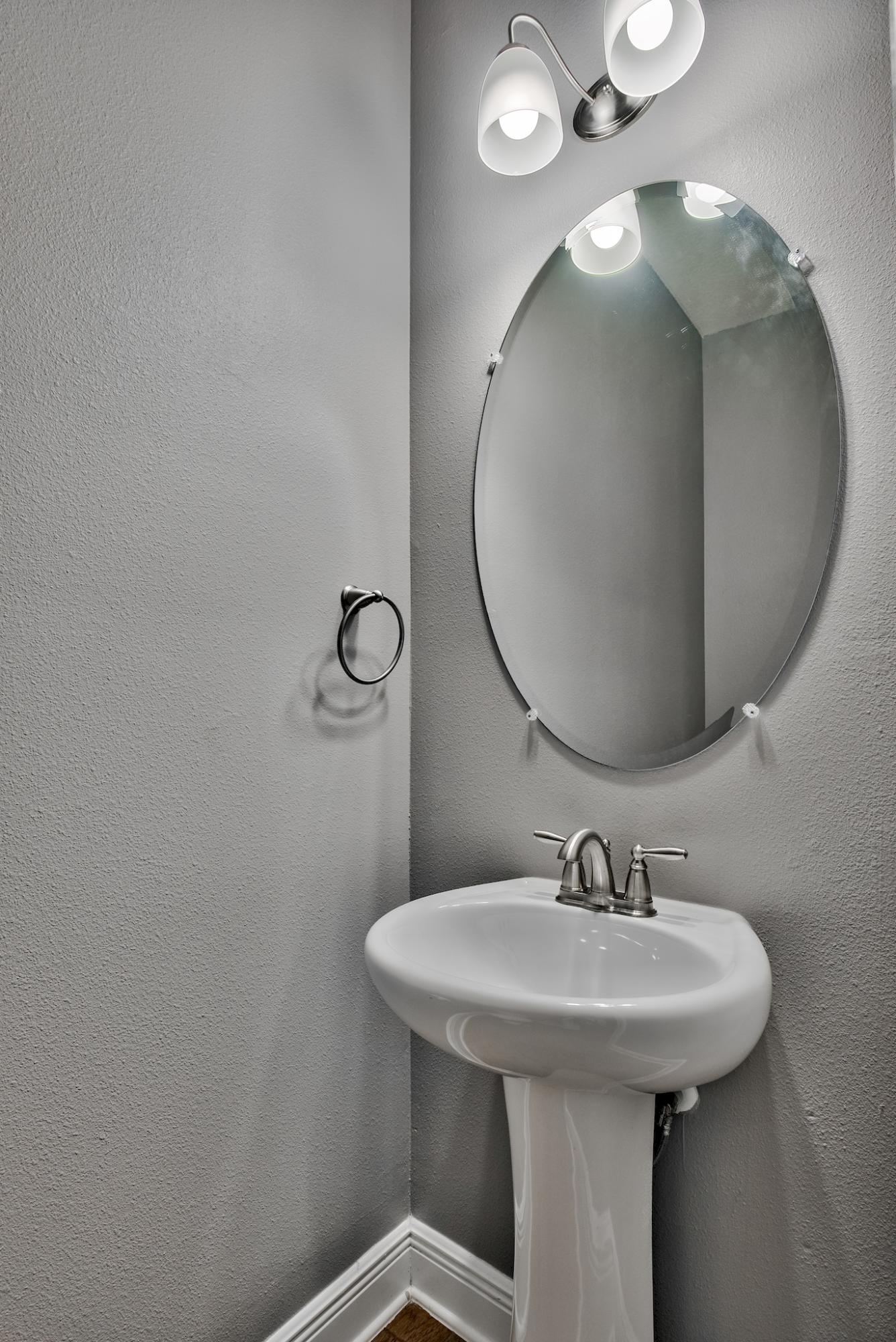 242 Pin Oak Loop Santa Rosa Beach, FL 32459 - Photo 11 of 43 a bathroom with a sink and mirror