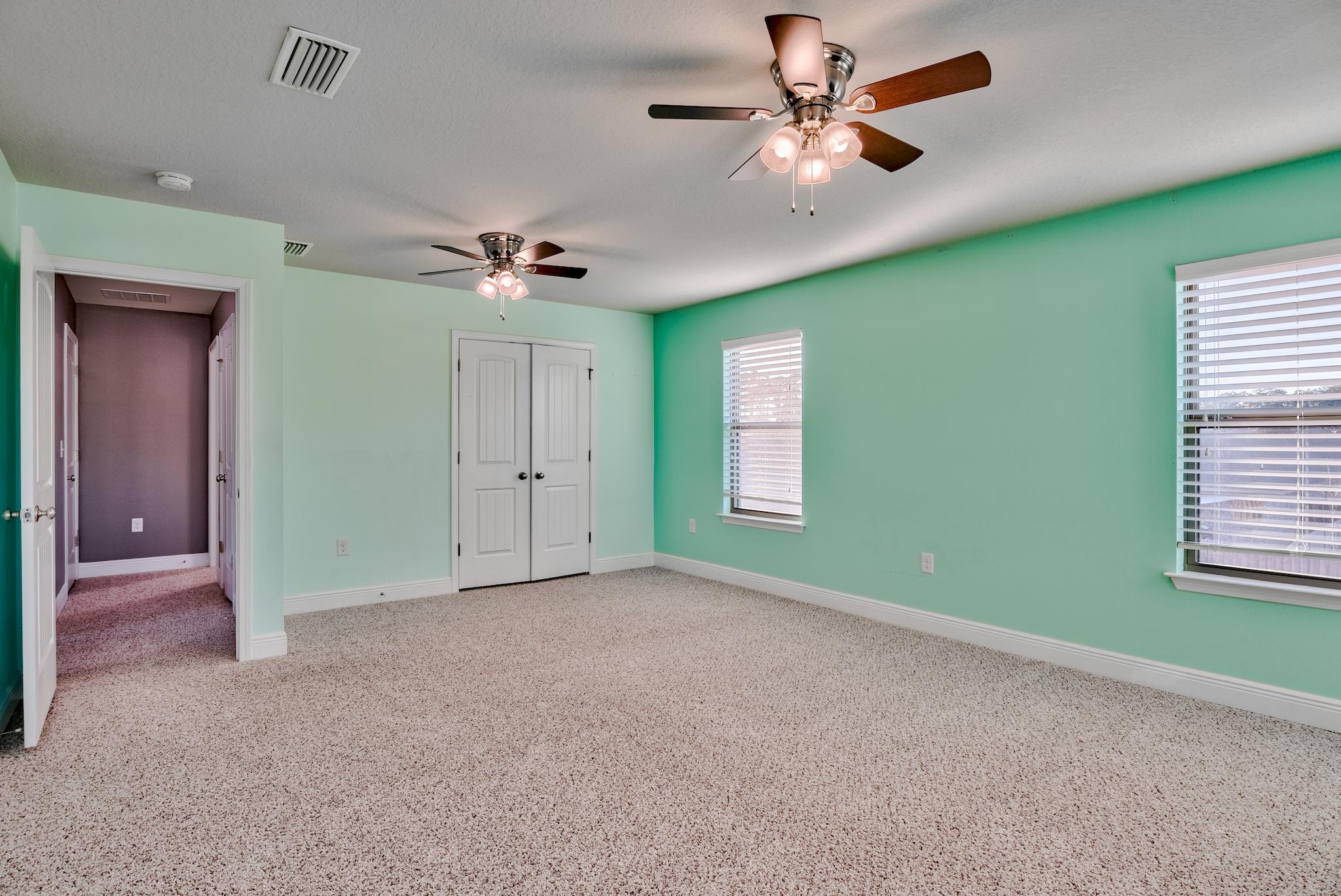 242 Pin Oak Loop Santa Rosa Beach, FL 32459 - Photo 28 of 43 a view of an empty room with a window