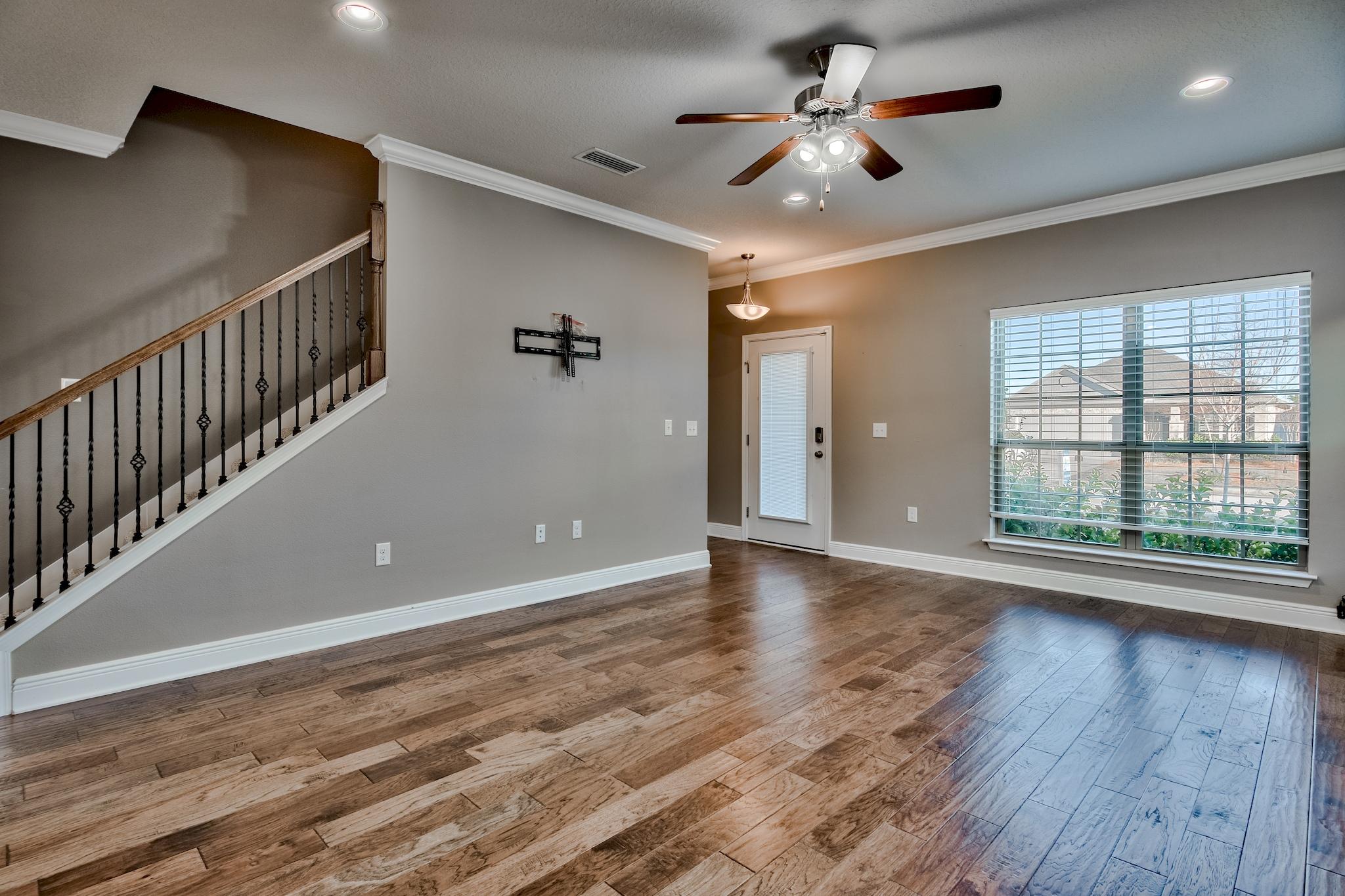 242 Pin Oak Loop Santa Rosa Beach, FL 32459 - Photo 3 of 43 wooden floor in an empty room with a window