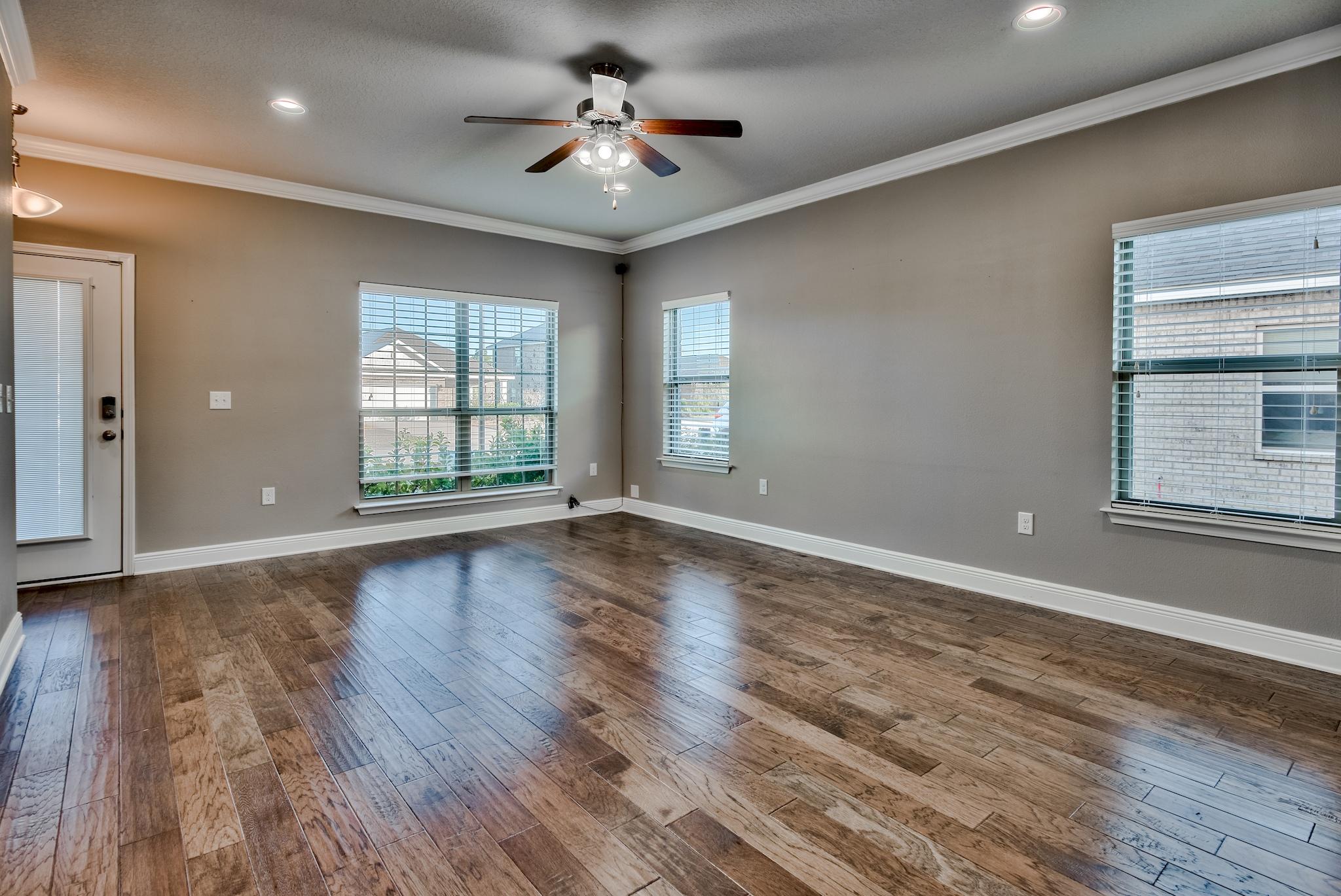 242 Pin Oak Loop Santa Rosa Beach, FL 32459 - Photo 6 of 43 a view of an empty room with wooden floor and a window