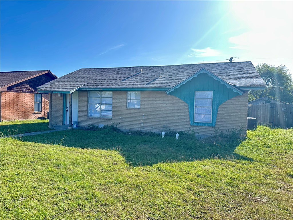 a view of a house with yard and a garden