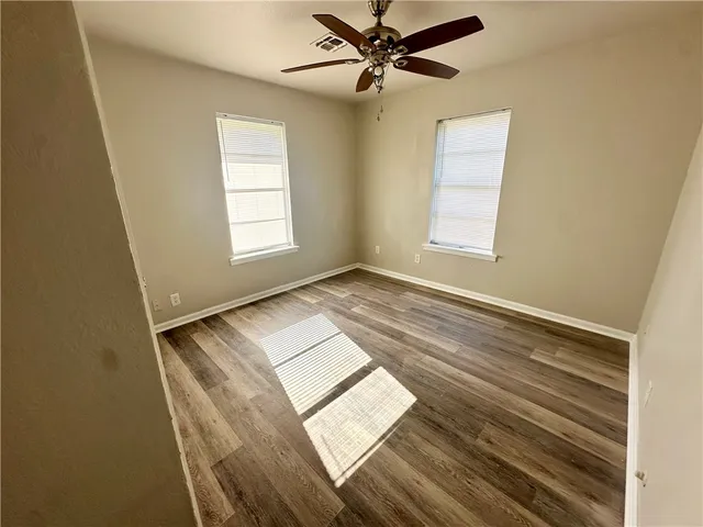 a view of an empty room and window