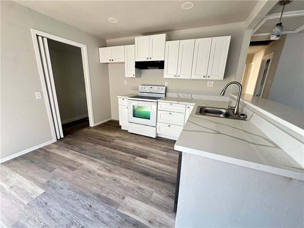 2552 Ave B Ingleside, TX 78362 - Photo 3 of 10 a kitchen with a refrigerator sink and stove
