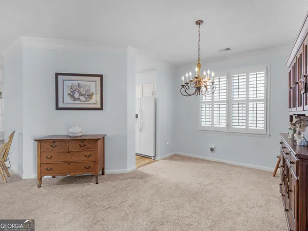 a view of room with window and cabinet