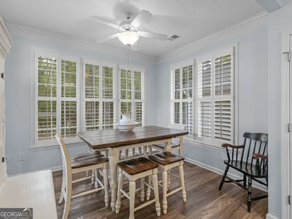 a view of a dining room with furniture window and wooden floor