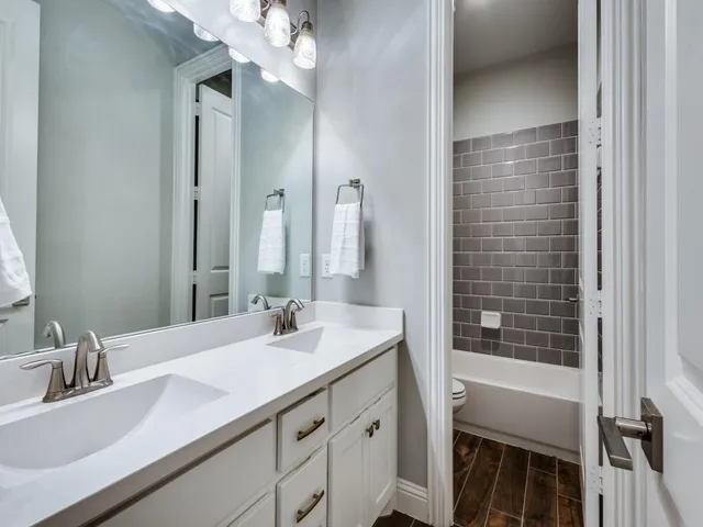 a bathroom with a sink a vanity and a mirror